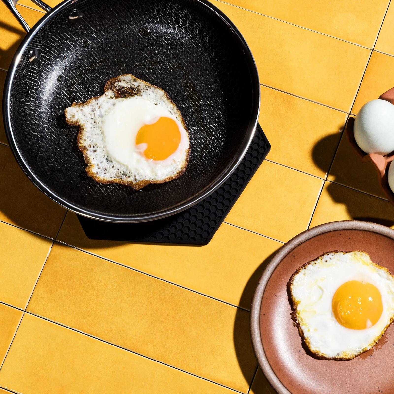 Fried egg sliding in a HexClad pan